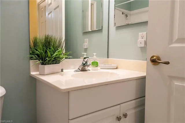 a bathroom with a shower curtain and a toilet