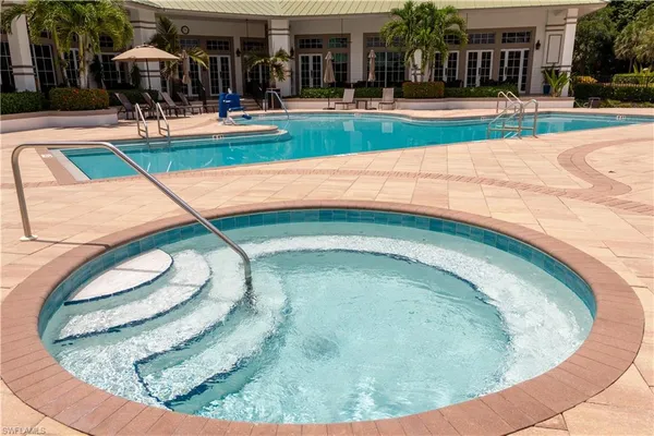 a view of a swimming pool with a patio