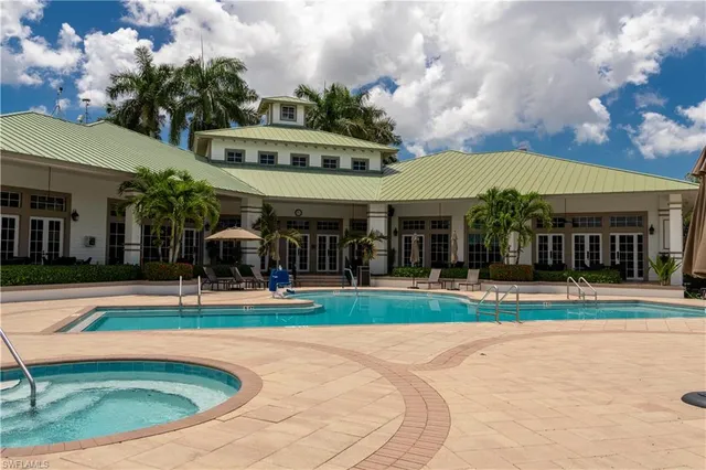 a view of a lake with houses in the back
