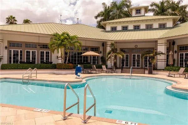 a view of swimming pool with seating space