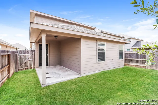 a view of backyard with a garden and deck