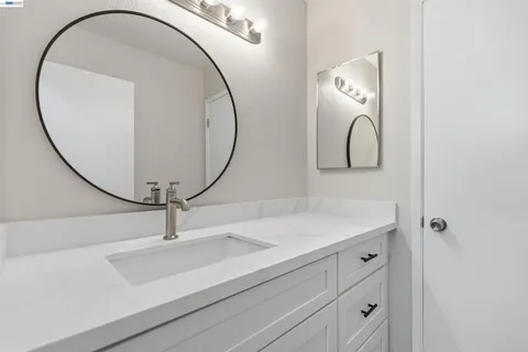 a bathroom with a sink and mirror