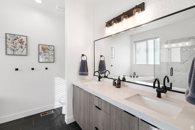 851 Grandview Drive Morgan, UT 84050 - Photo 21 of 68 Dual vanity featuring wood-finish cabinetry, white countertops, and matte black fixtures