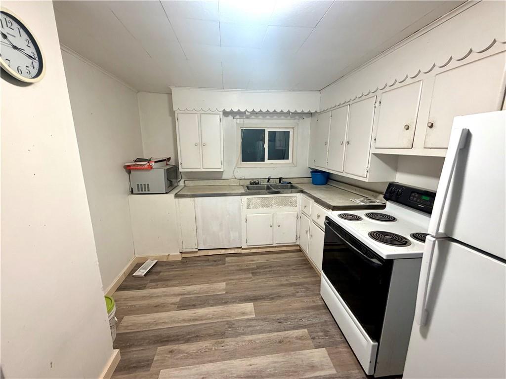 1010 Kiester Road Slippery Rock, PA 16057 - Photo 15 of 21 a kitchen with a sink stove and cabinets