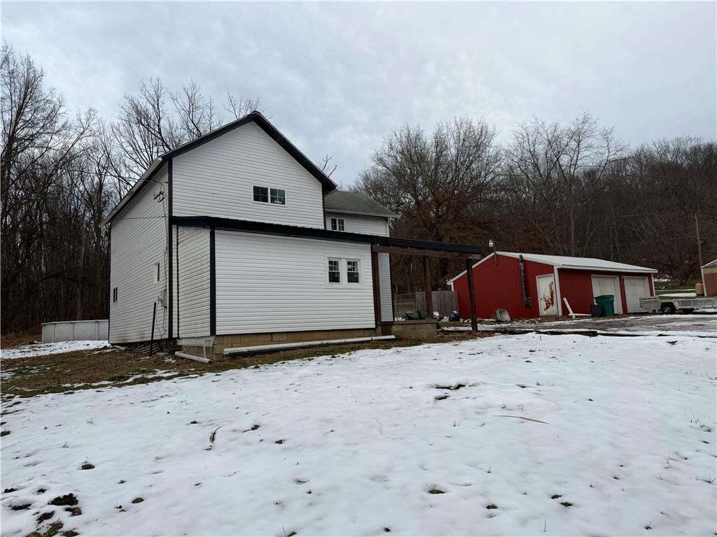 1010 Kiester Road Slippery Rock, PA 16057 - Photo 3 of 21 a view of a barn with a yard covered in snow