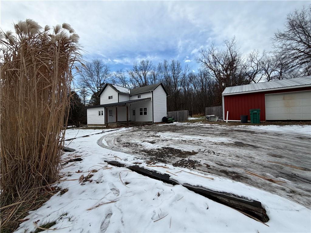 1010 Kiester Road Slippery Rock, PA 16057 - Photo 5 of 21 a view of a house with a yard covered in snow