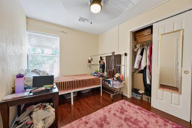 a bedroom with furniture and a window