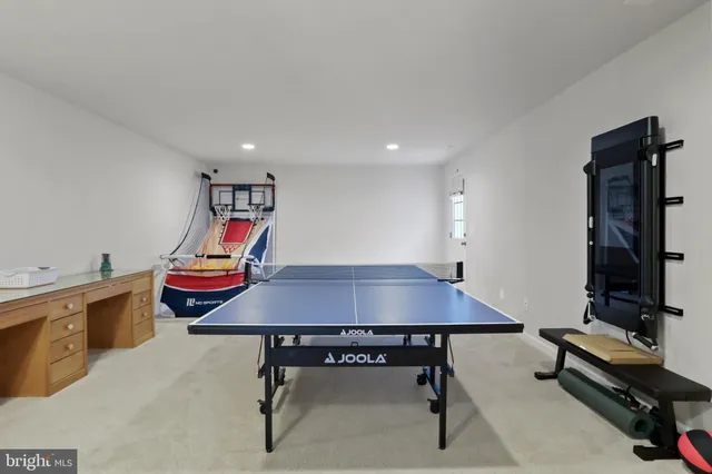 a room with furniture and pool table