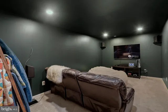 a bed room with furniture and a flat screen tv