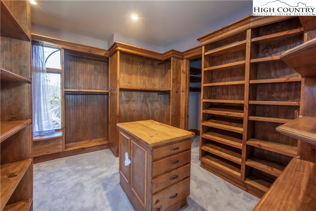 171 Acanthus Trail Boone, NC 28607 - Photo 17 of 49 a view of walk in closet with empty racks