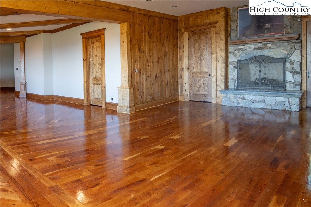 171 Acanthus Trail Boone, NC 28607 - Photo 26 of 49 a view of empty room with wooden floor and fireplace
