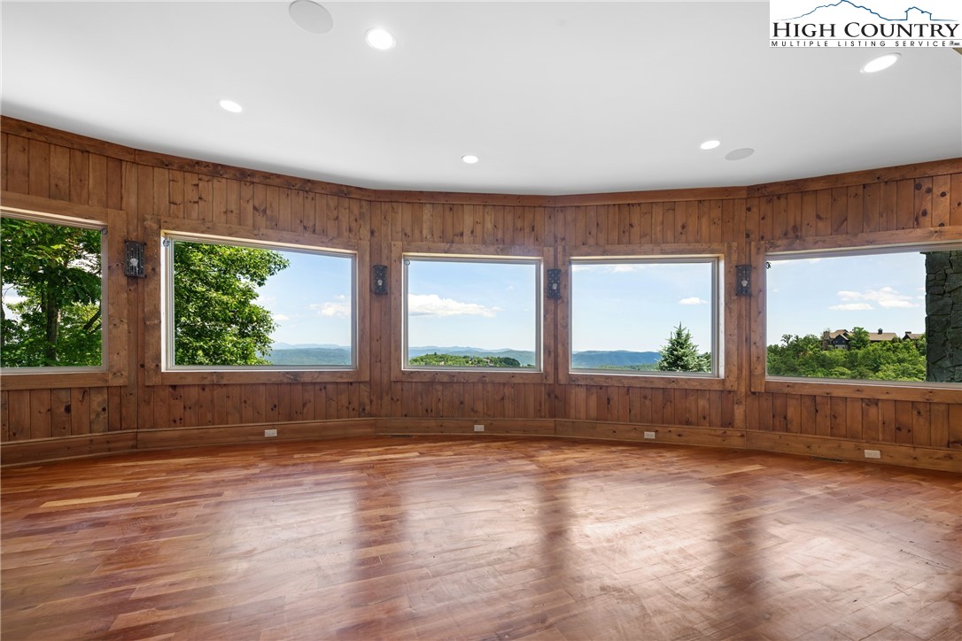 171 Acanthus Trail Boone, NC 28607 - Photo 27 of 49 an empty room with wooden floor and windows