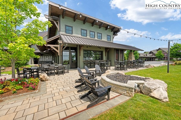 171 Acanthus Trail Boone, NC 28607 - Photo 38 of 49 a view of a patio with swimming pool table and chairs