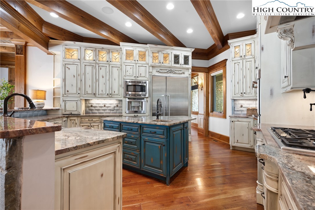 171 Acanthus Trail Boone, NC 28607 - Photo 10 of 49 a kitchen with stainless steel appliances granite countertop a sink stove and refrigerator