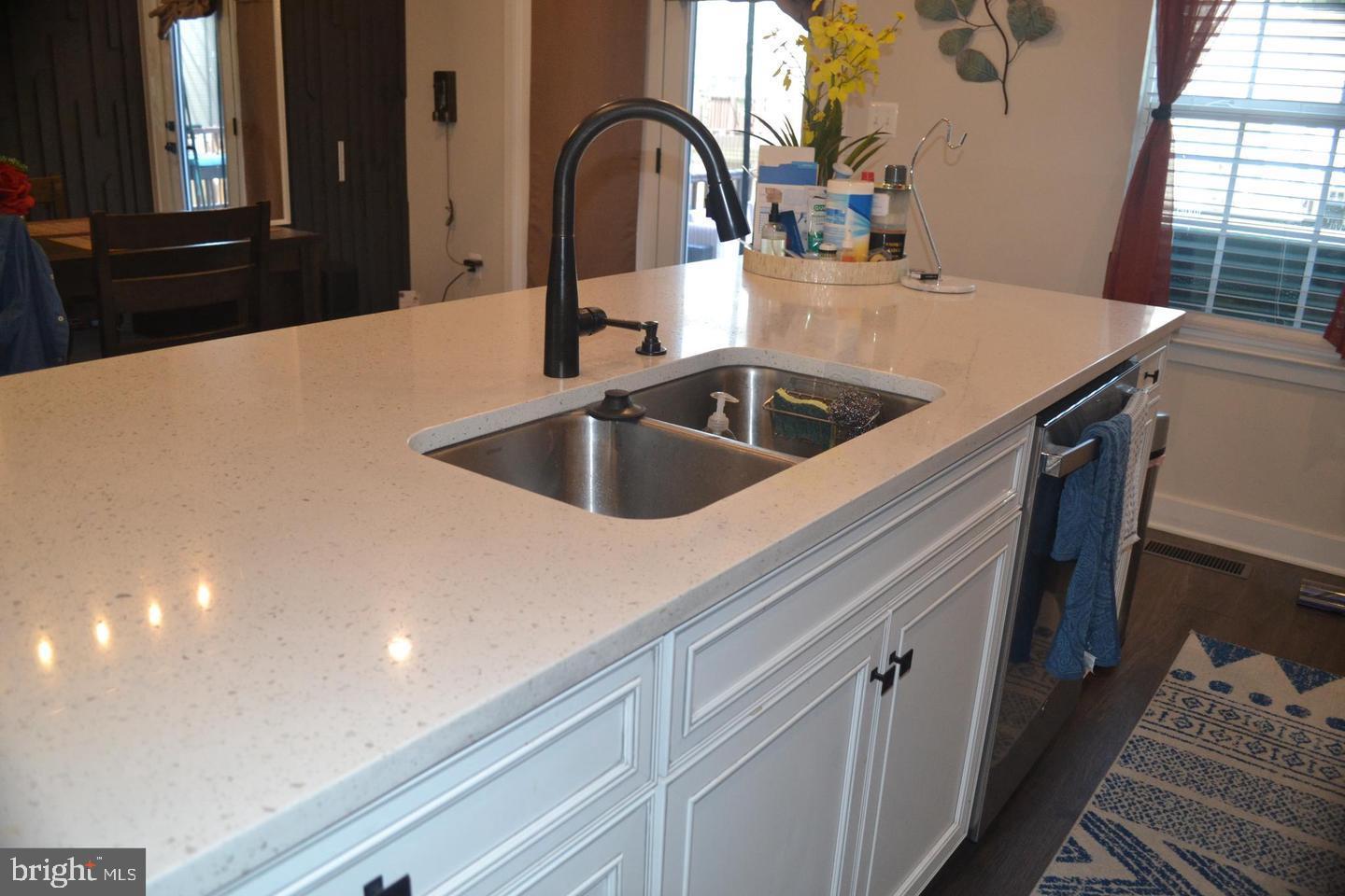 1015 Rampart Drive Fredericksburg, VA 22401 - Photo 11 of 37 a kitchen with a sink and a refrigerator with a dishwasher