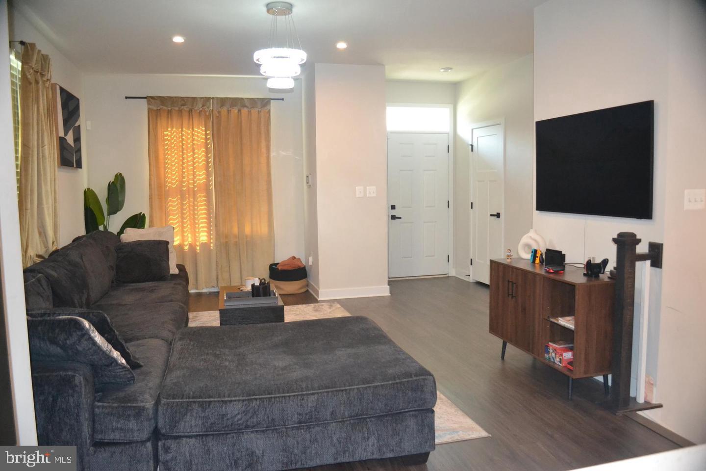 1015 Rampart Drive Fredericksburg, VA 22401 - Photo 13 of 37 a living room with furniture and a flat screen tv