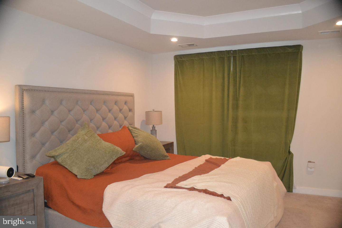 1015 Rampart Drive Fredericksburg, VA 22401 - Photo 17 of 37 a bedroom with a bed and curtain