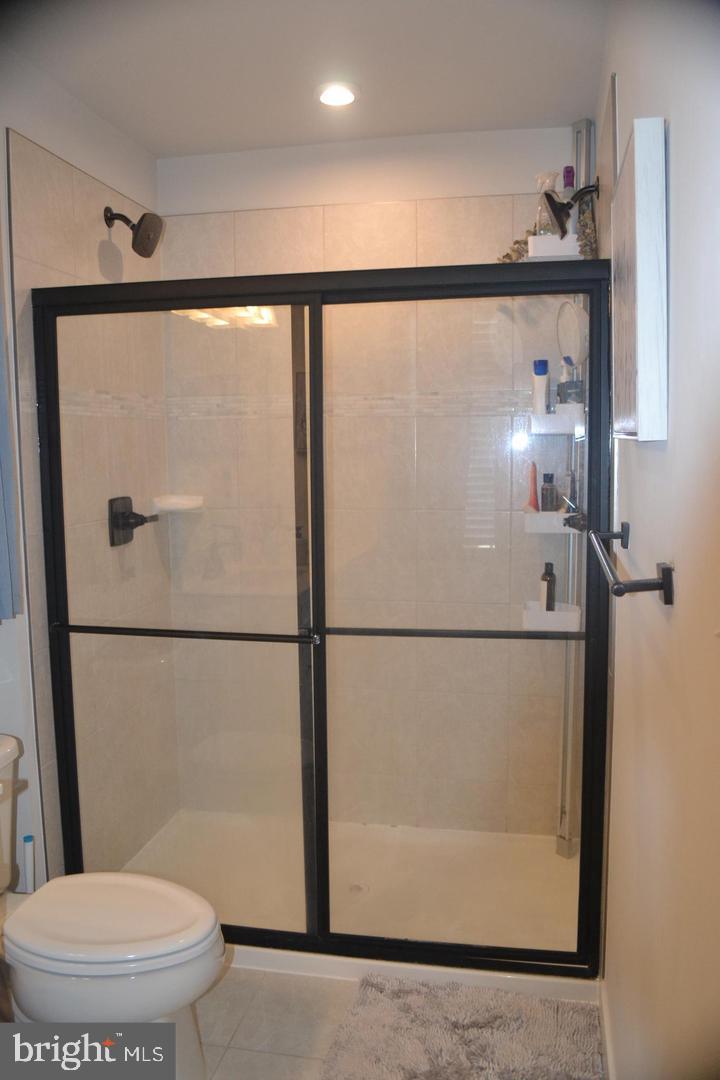 1015 Rampart Drive Fredericksburg, VA 22401 - Photo 19 of 37 a bathroom with a toilet a sink and a shower