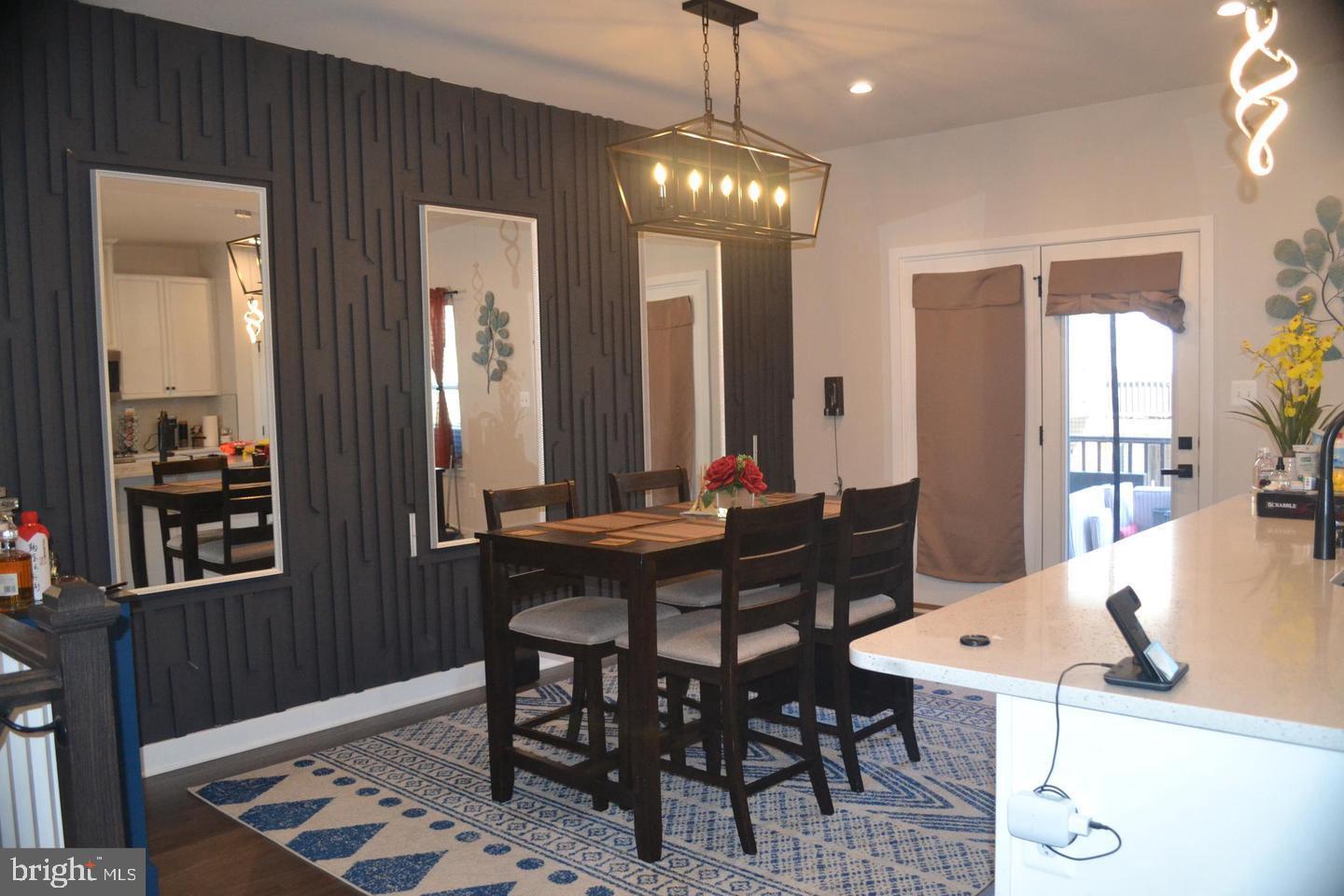 1015 Rampart Drive Fredericksburg, VA 22401 - Photo 2 of 37 a view of a dining room with furniture and chandelier