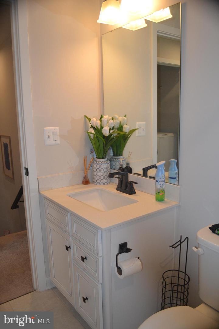 1015 Rampart Drive Fredericksburg, VA 22401 - Photo 25 of 37 a bathroom with a sink a toilet and with mirror