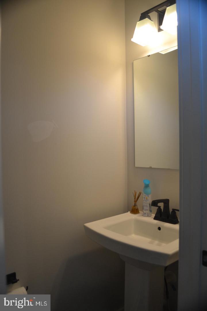 1015 Rampart Drive Fredericksburg, VA 22401 - Photo 28 of 37 a bathroom with a sink and mirror