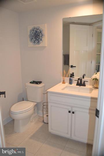 1015 Rampart Drive Fredericksburg, VA 22401 - Photo 29 of 37 a bathroom with a sink mirror vanity and toilet