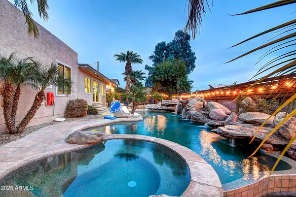 a view of swimming pool with outdoor seating