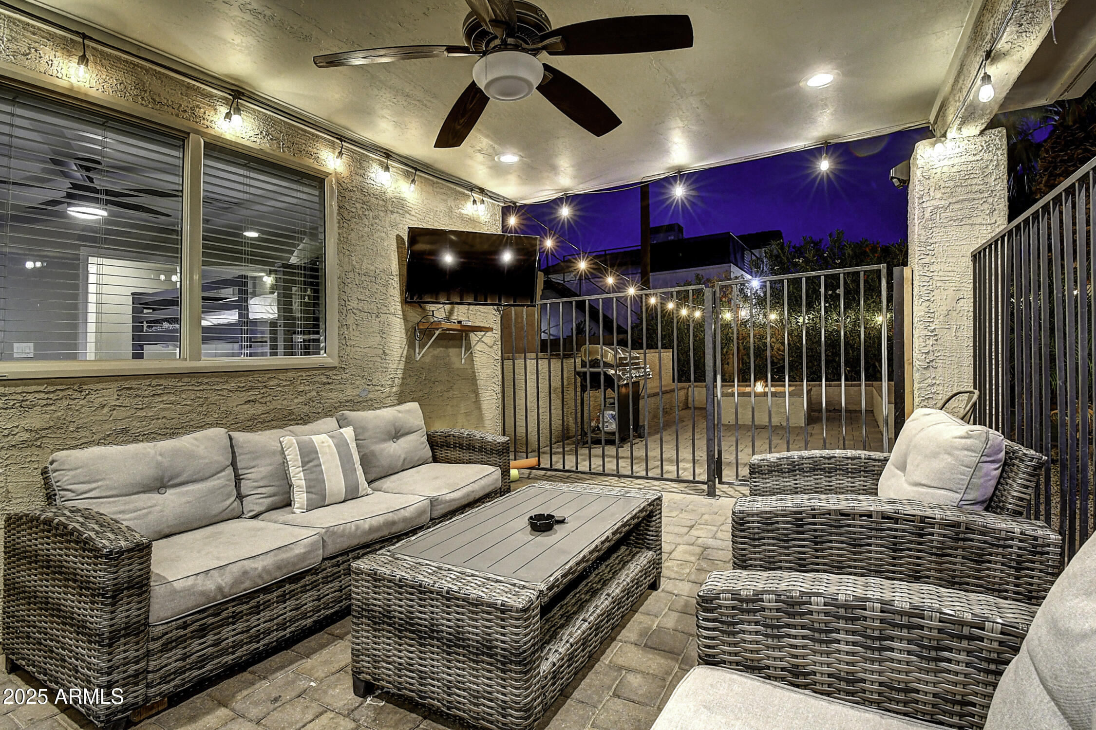 4101 East Nisbet Road Phoenix, AZ 85032 - Photo 12 of 64 a living room with furniture and a flat screen tv