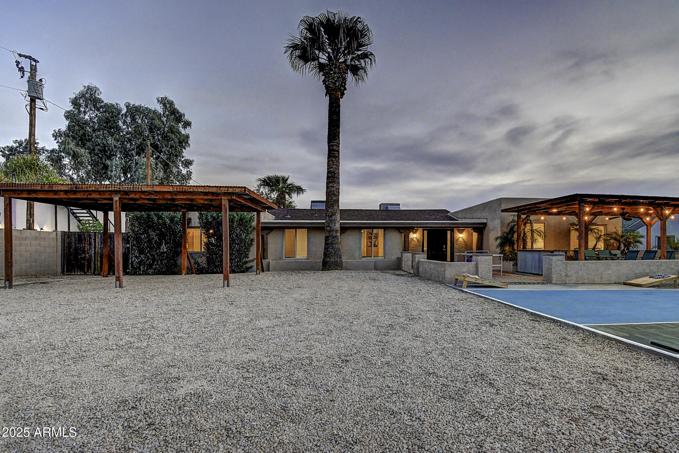 4101 East Nisbet Road Phoenix, AZ 85032 - Photo 13 of 64 a front view of a house with large windows and a yard