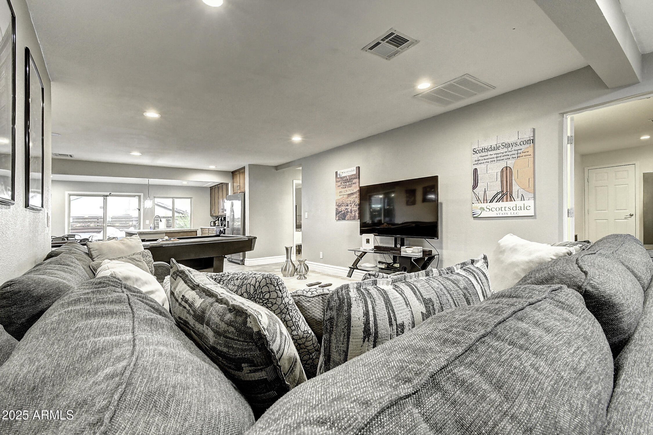 4101 East Nisbet Road Phoenix, AZ 85032 - Photo 21 of 64 a living room with furniture and a flat screen tv