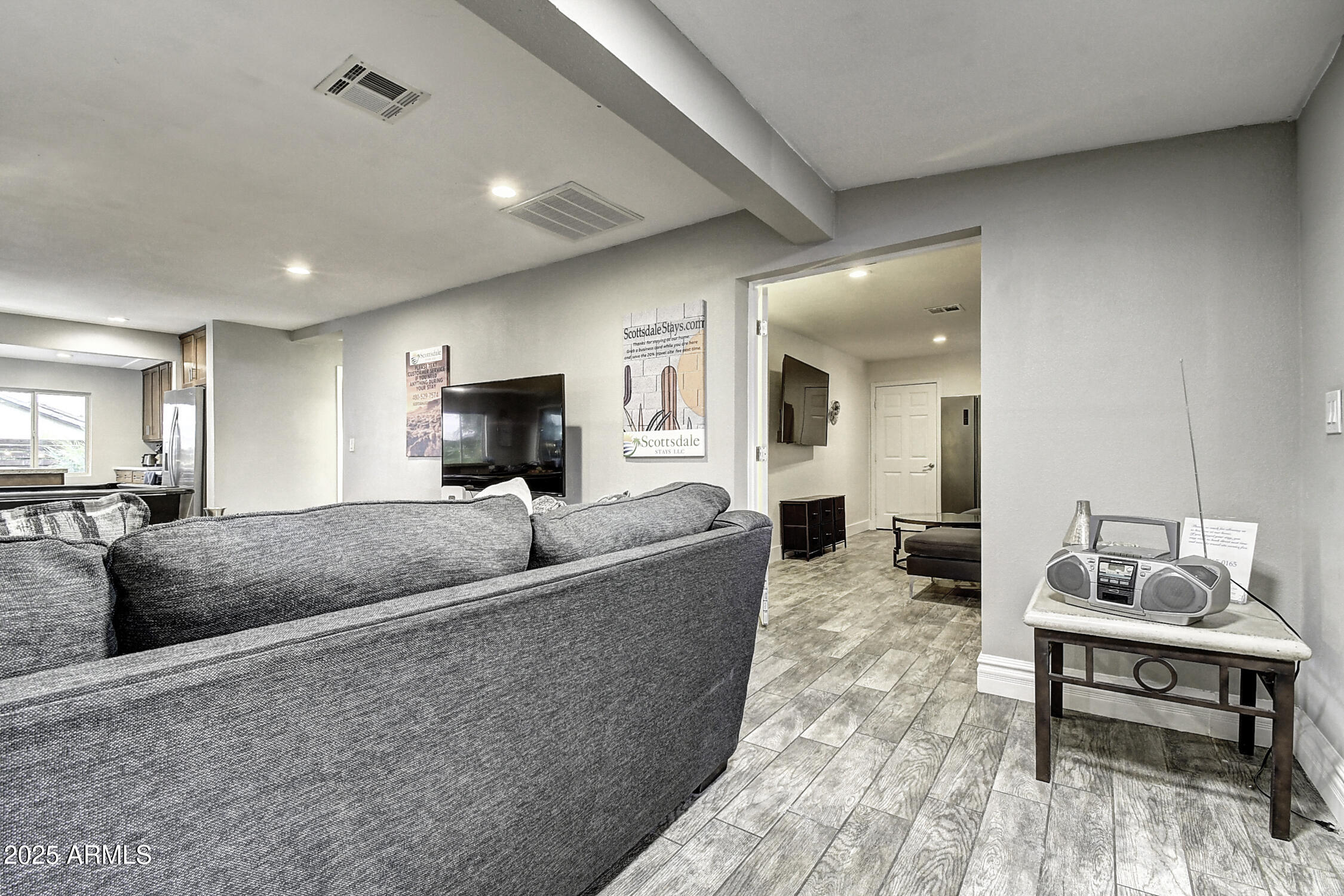 4101 East Nisbet Road Phoenix, AZ 85032 - Photo 22 of 64 a living room with furniture and a wooden floor