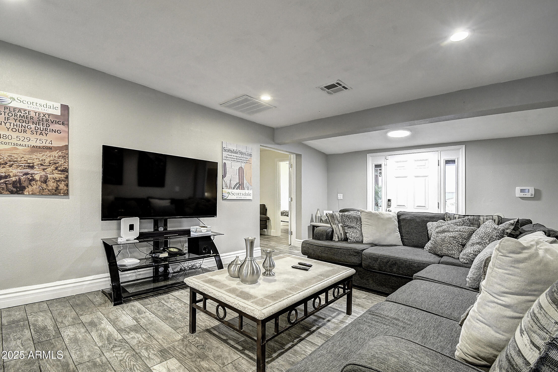 4101 East Nisbet Road Phoenix, AZ 85032 - Photo 23 of 64 a living room with furniture and a flat screen tv