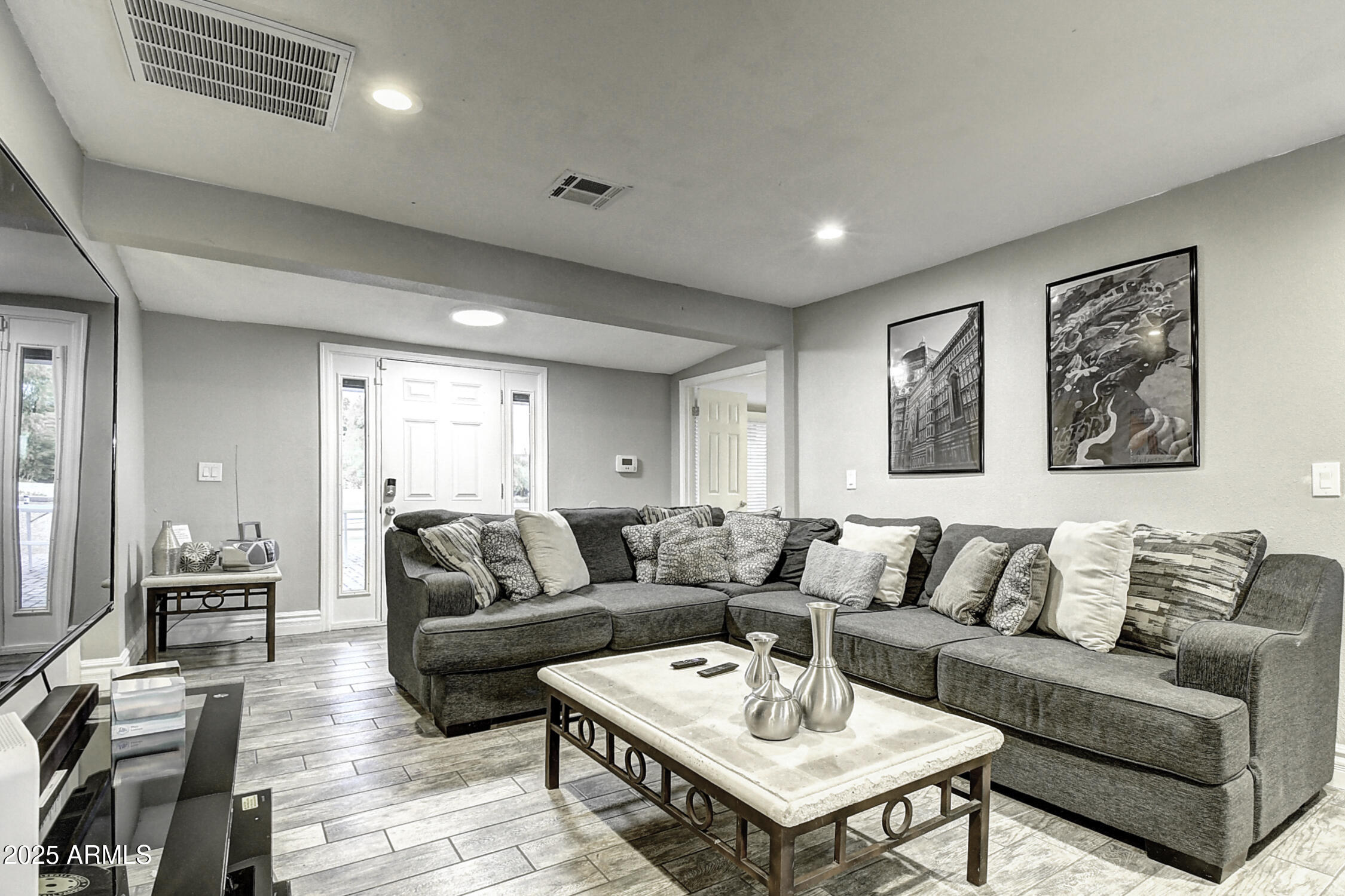 4101 East Nisbet Road Phoenix, AZ 85032 - Photo 26 of 64 a living room with furniture and a wooden floor
