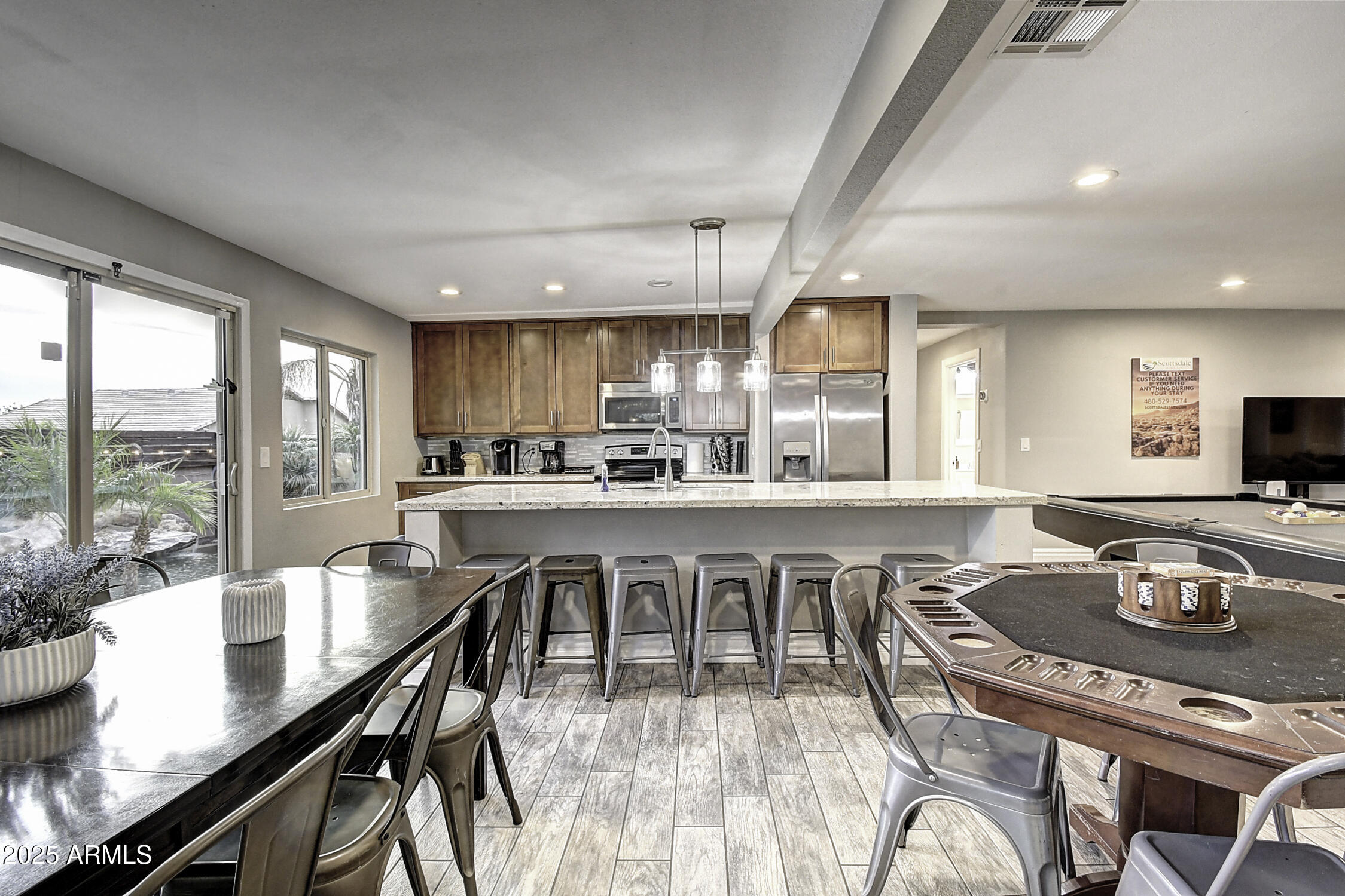 4101 East Nisbet Road Phoenix, AZ 85032 - Photo 32 of 64 a dining table with chairs and window