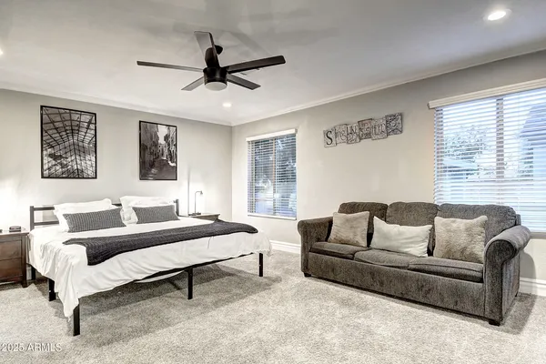 a bedroom with a bed and a lamp