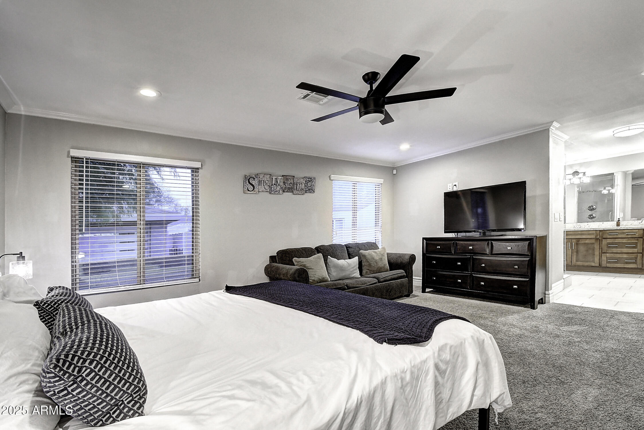 4101 East Nisbet Road Phoenix, AZ 85032 - Photo 36 of 64 a bedroom with a bed and a television