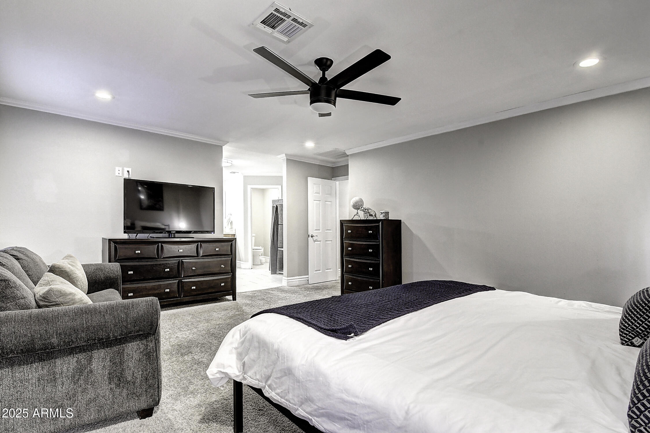 4101 East Nisbet Road Phoenix, AZ 85032 - Photo 37 of 64 a bedroom with a bed and a flat screen tv