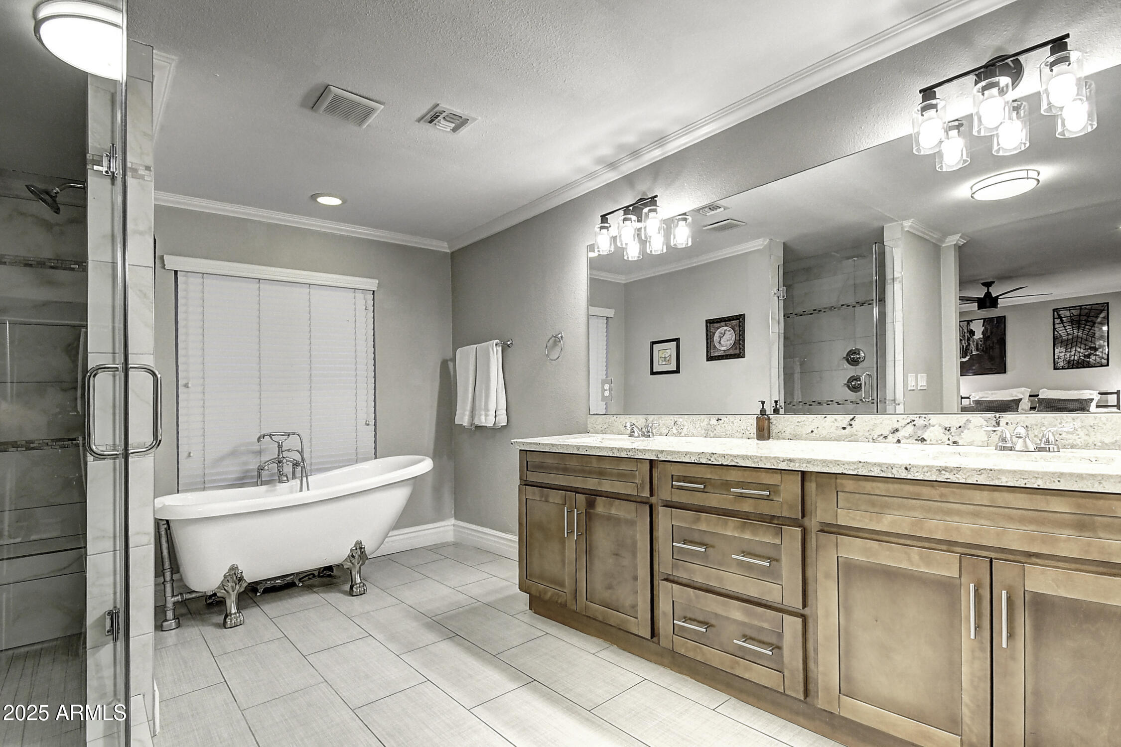 4101 East Nisbet Road Phoenix, AZ 85032 - Photo 40 of 64 a spacious bathroom with a double vanity sink a mirror and a bathtub