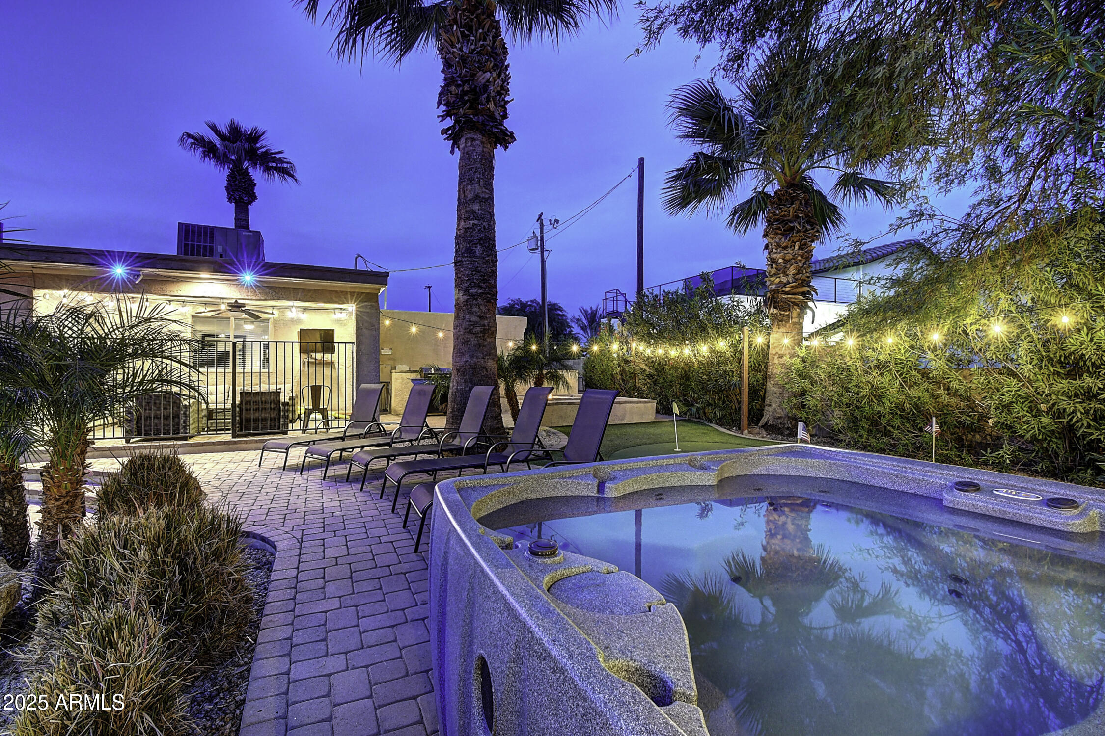 4101 East Nisbet Road Phoenix, AZ 85032 - Photo 4 of 64 a view of a swimming pool with a patio