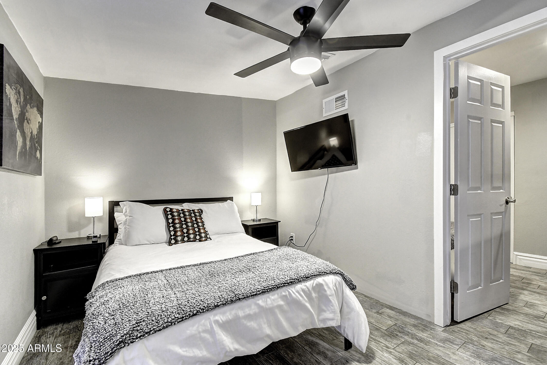 4101 East Nisbet Road Phoenix, AZ 85032 - Photo 43 of 64 a bedroom with a bed and a flat screen tv