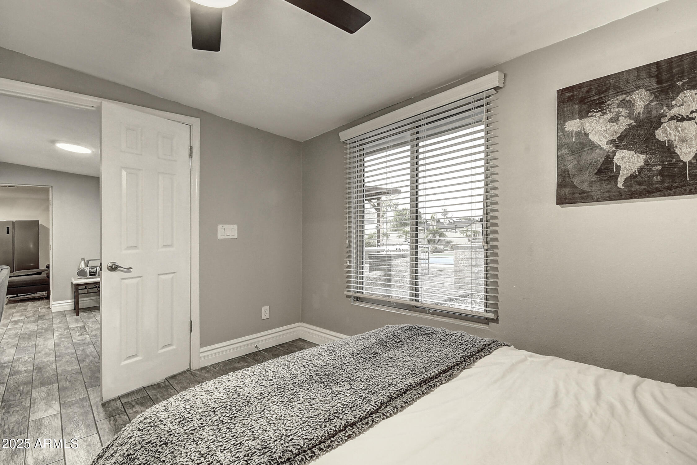 4101 East Nisbet Road Phoenix, AZ 85032 - Photo 44 of 64 a view of an empty room with window and wooden floor
