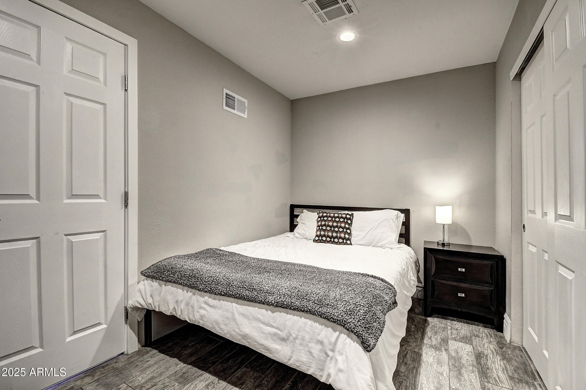 4101 East Nisbet Road Phoenix, AZ 85032 - Photo 45 of 64 a bedroom with a bed and a lamp