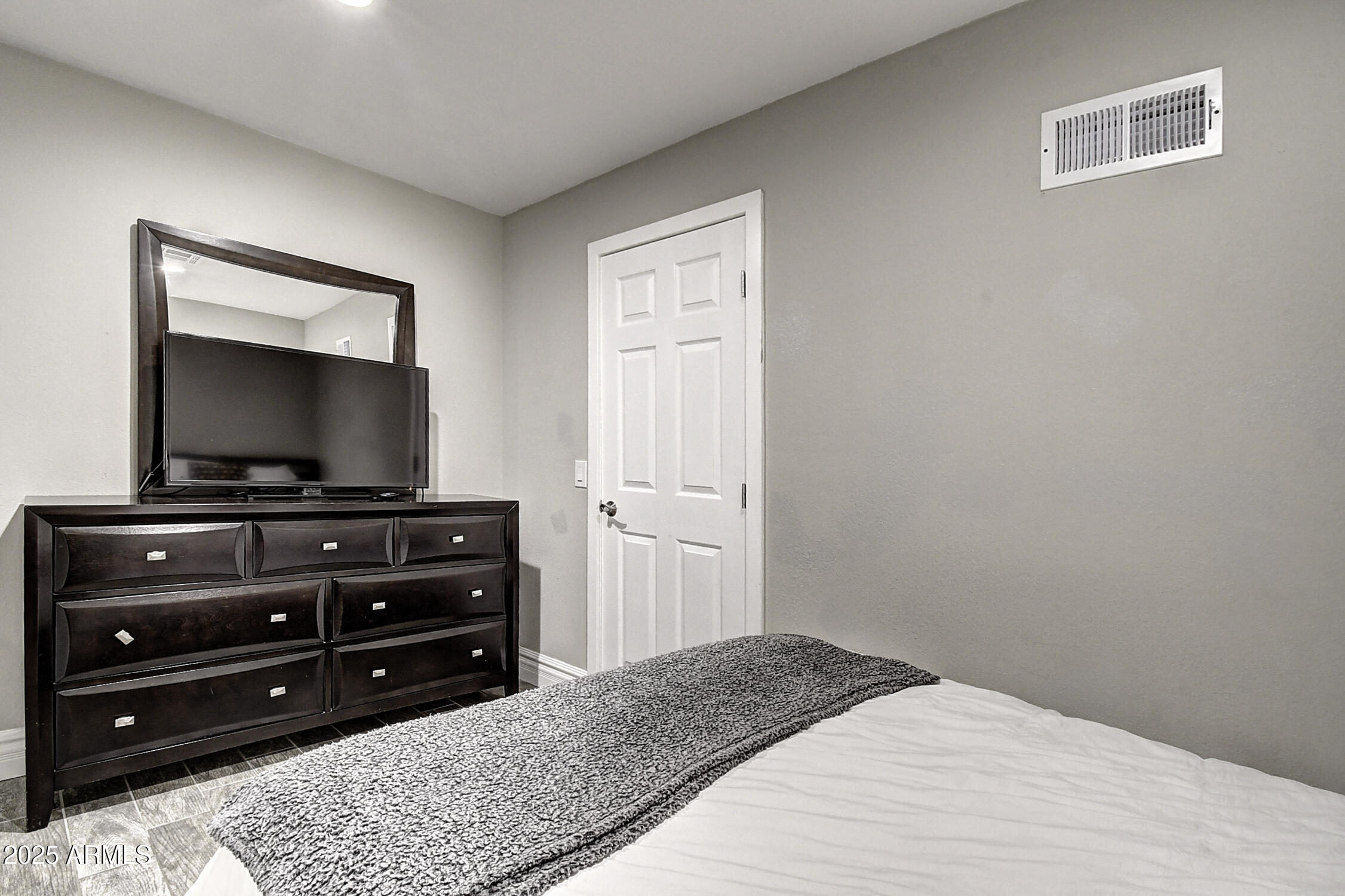 4101 East Nisbet Road Phoenix, AZ 85032 - Photo 46 of 64 a bedroom with a bed and a flat screen tv