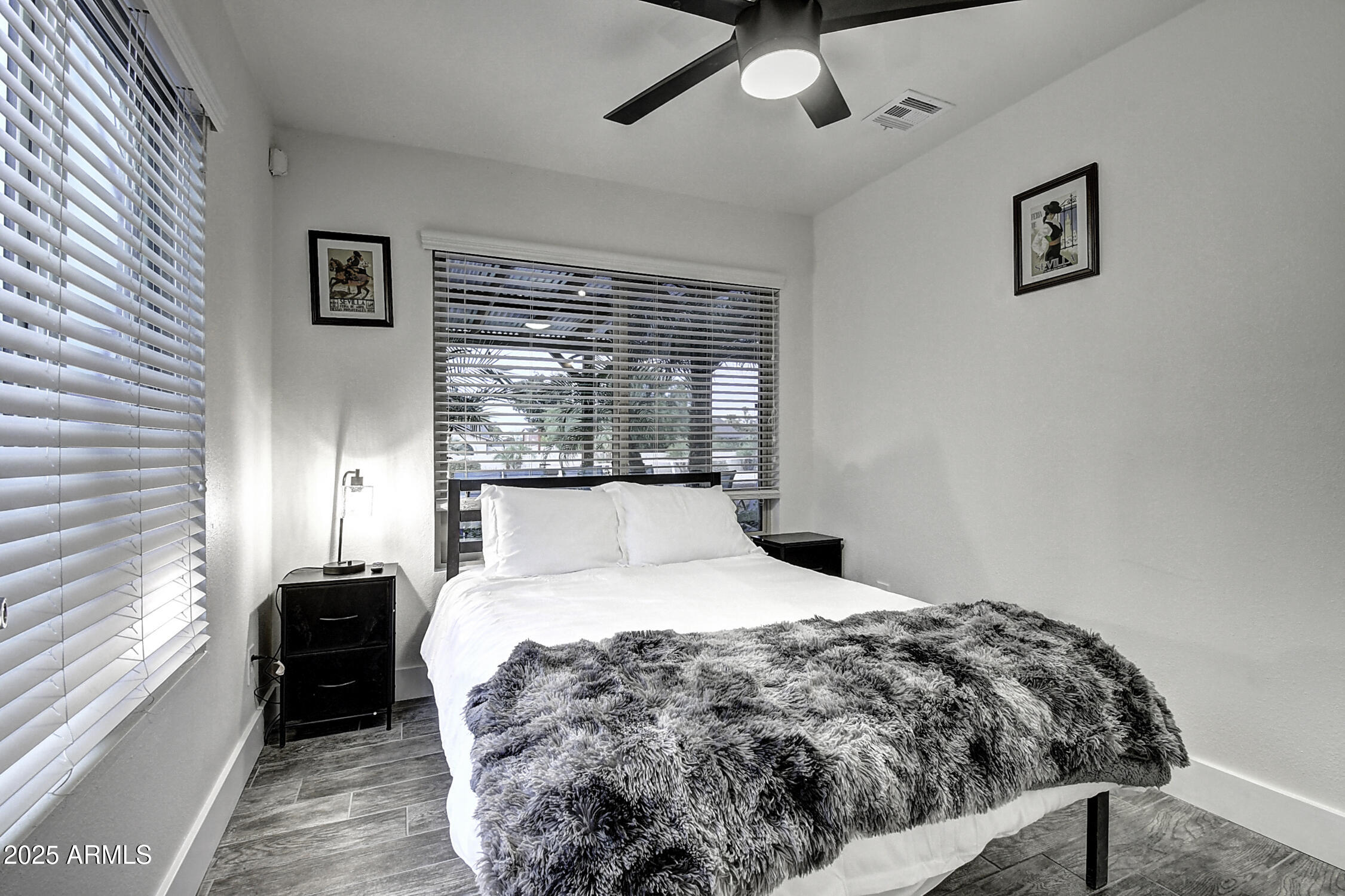 4101 East Nisbet Road Phoenix, AZ 85032 - Photo 50 of 64 a bed sitting in a bedroom next to a window