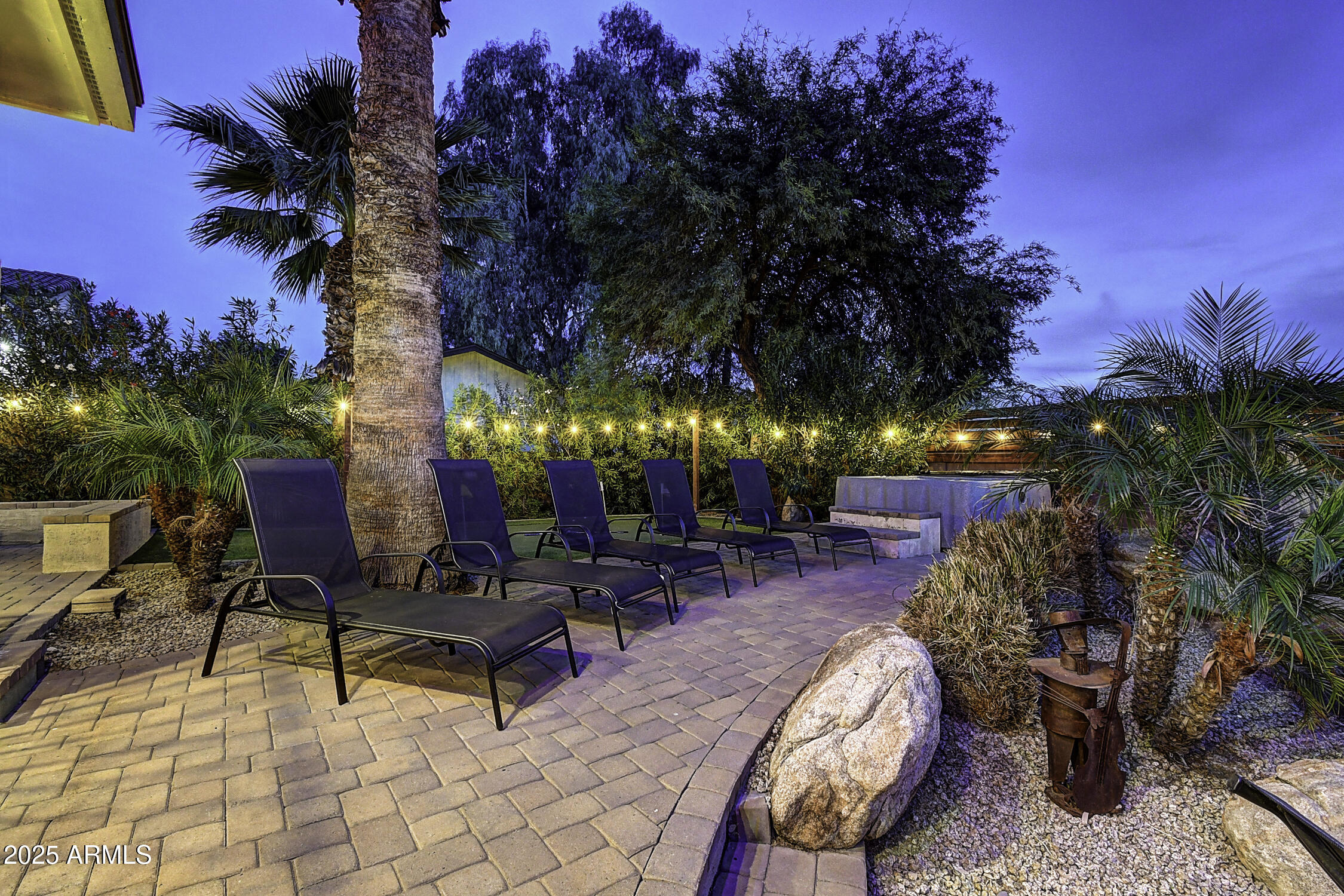 4101 East Nisbet Road Phoenix, AZ 85032 - Photo 5 of 64 a view of a backyard with a patio and fire pit