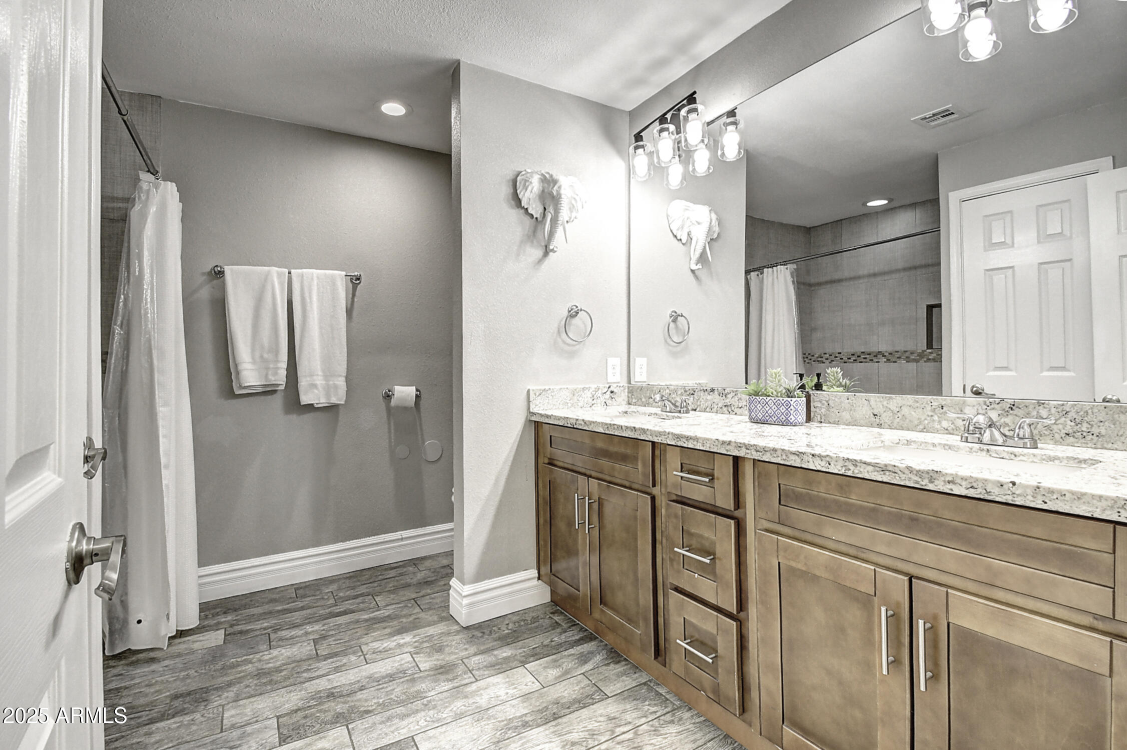 4101 East Nisbet Road Phoenix, AZ 85032 - Photo 53 of 64 a bathroom with a granite countertop sink and a mirror