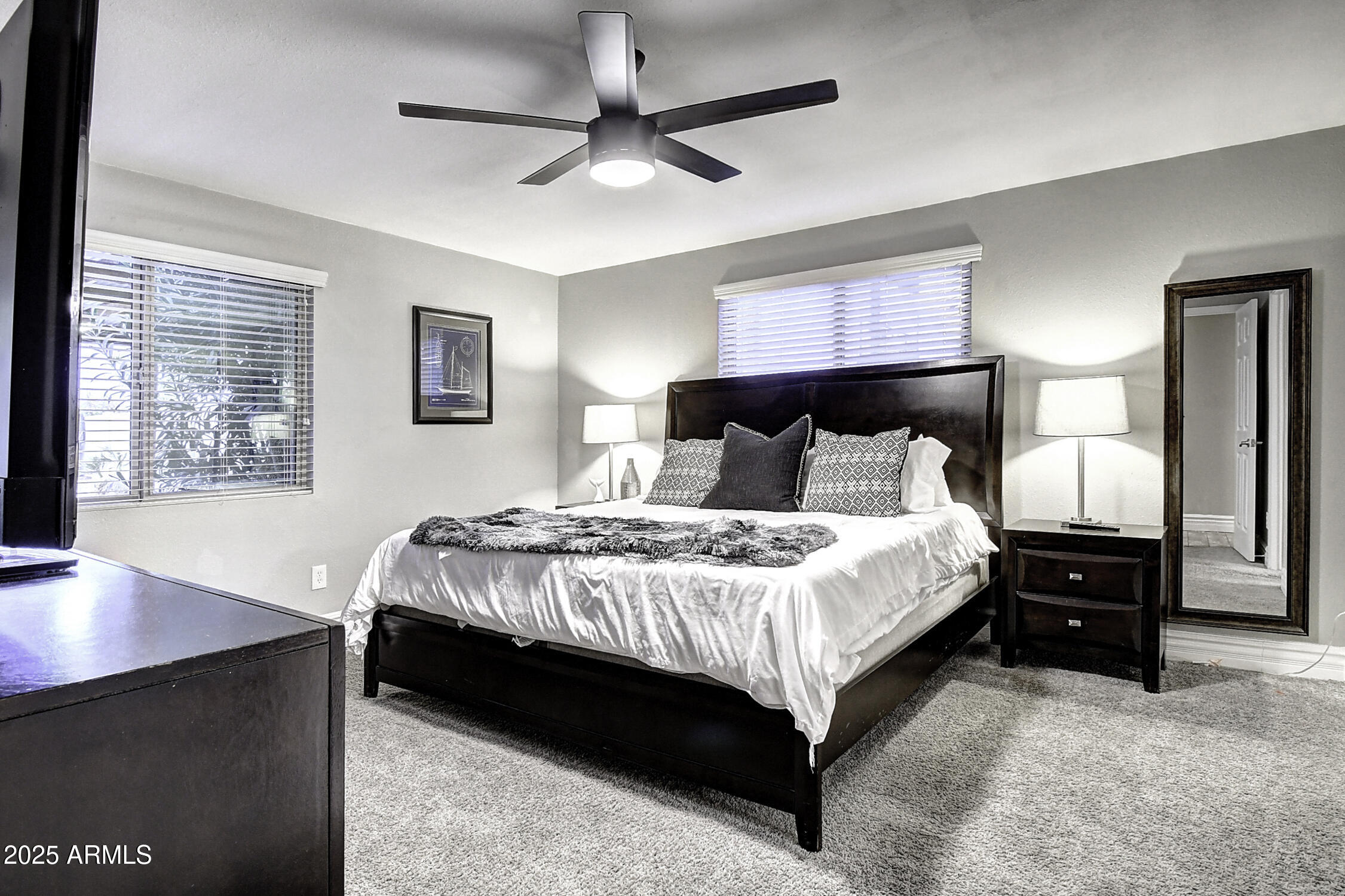 4101 East Nisbet Road Phoenix, AZ 85032 - Photo 55 of 64 a bedroom with a bed and a desk with stool