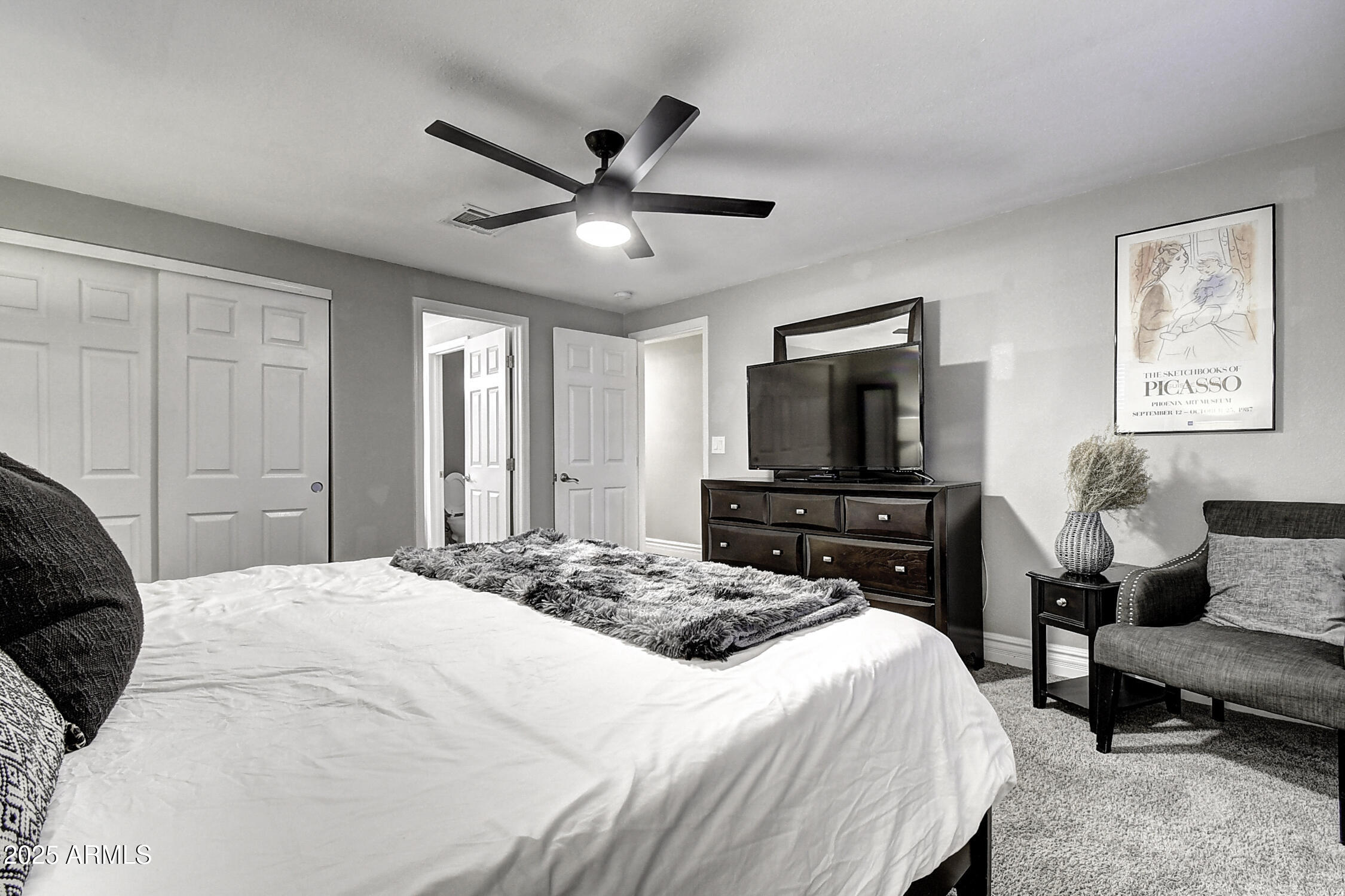 4101 East Nisbet Road Phoenix, AZ 85032 - Photo 56 of 64 a bedroom with a bed and a tv on dresser