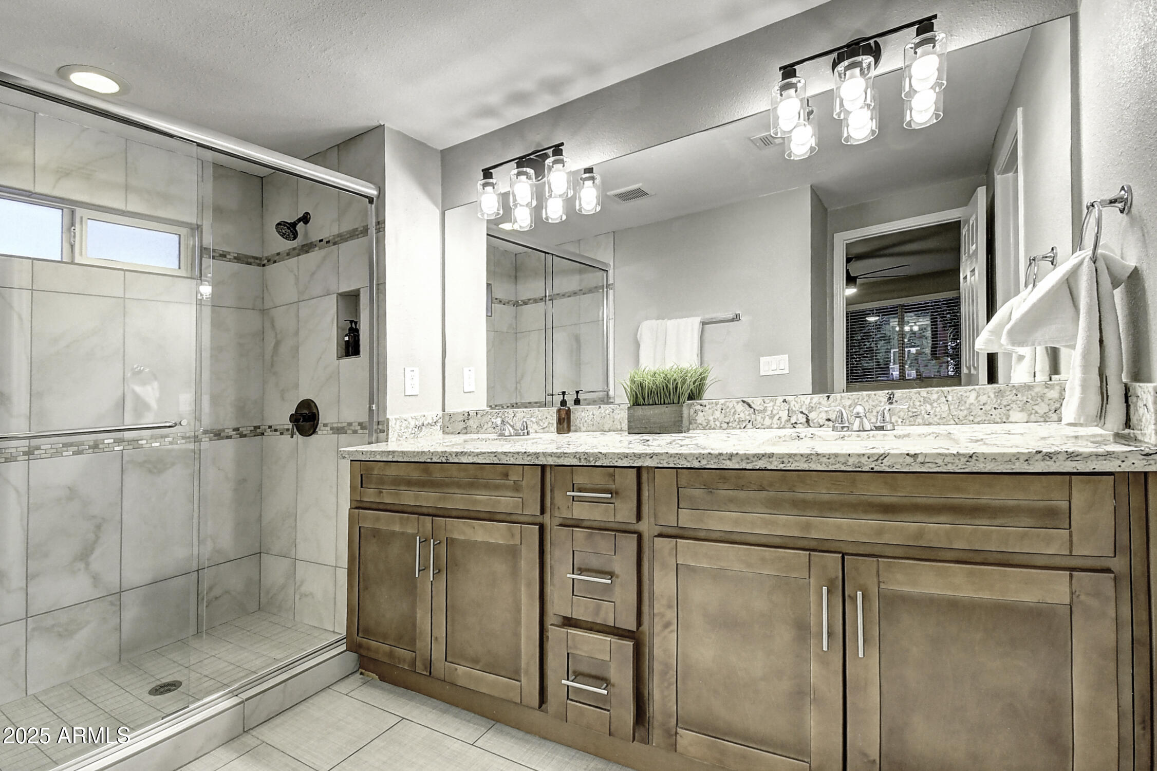4101 East Nisbet Road Phoenix, AZ 85032 - Photo 57 of 64 a bathroom with a shower sink and mirror