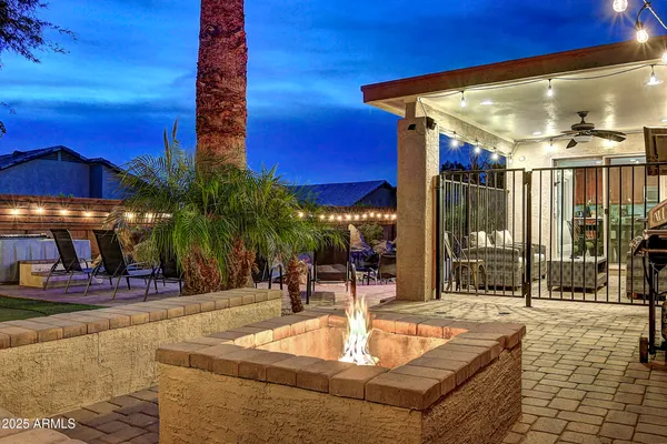 a view of a swimming pool with outdoor seating